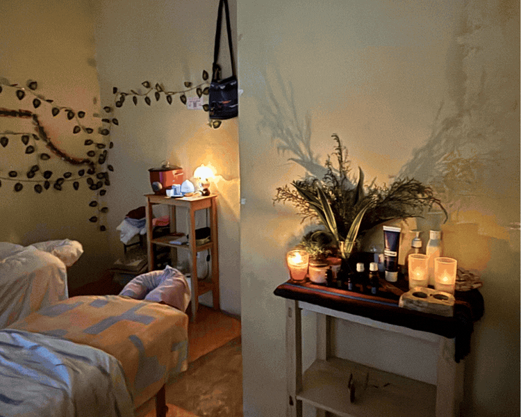 Cozy massage treatment room with warm lighting and lake view in San Marcos La Laguna